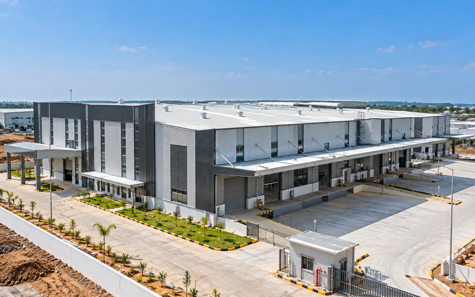 Industrial facility with integrated roofing, wall cladding and loading areas