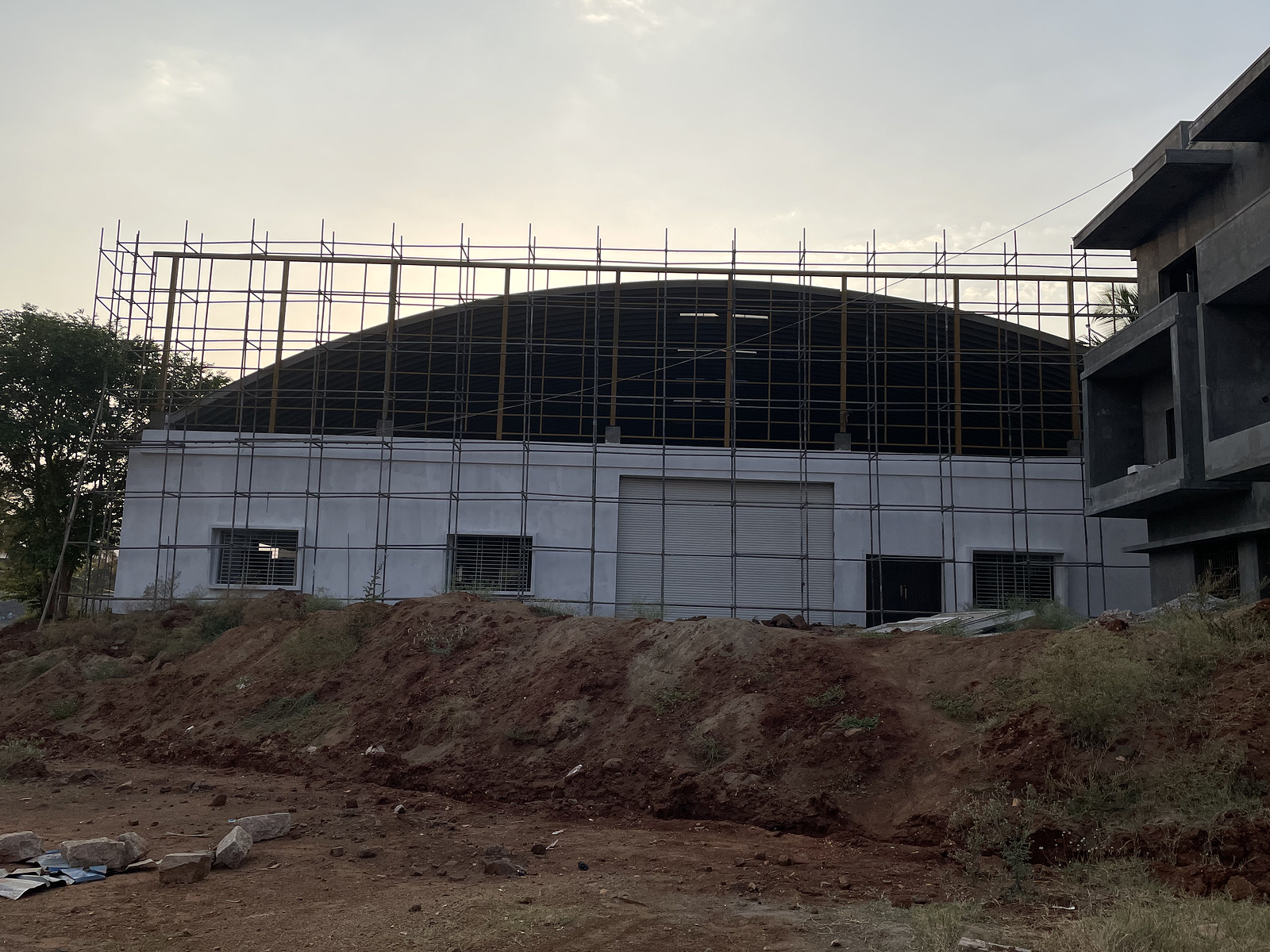 Closer project view showing the roof structure and supporting building frame.