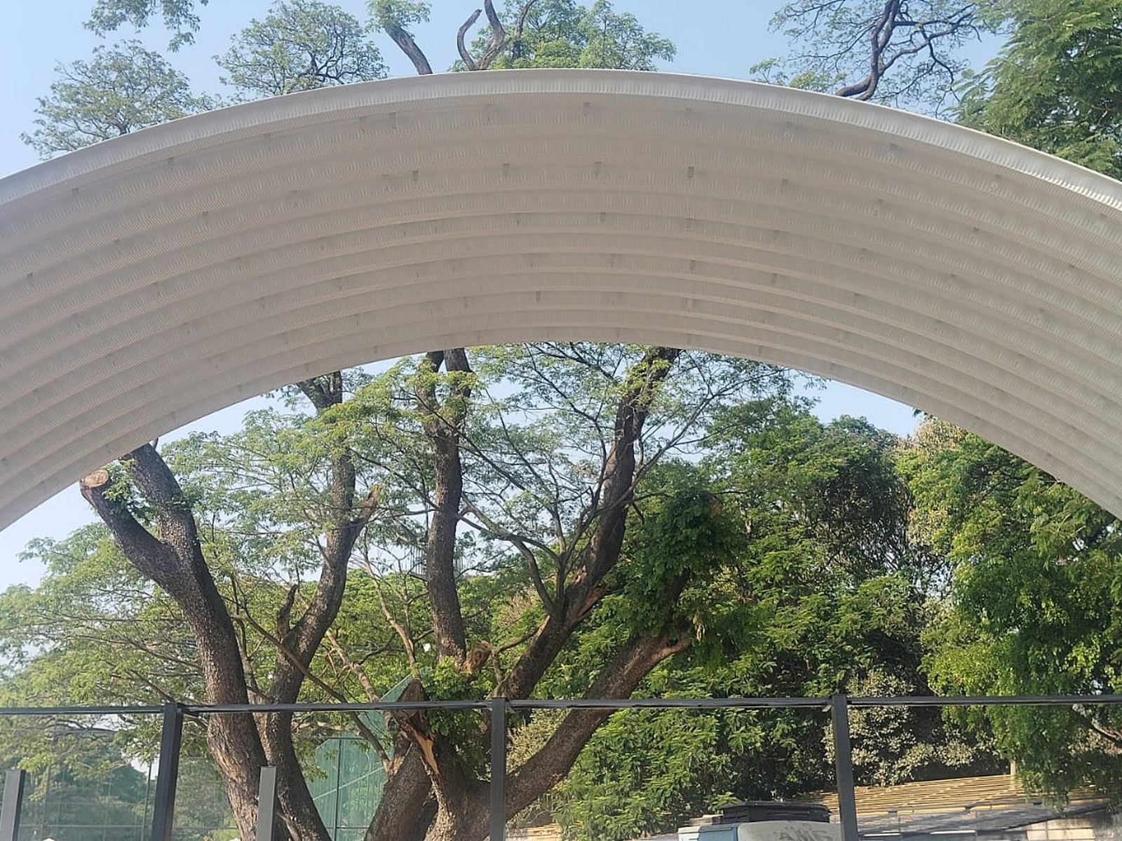 Closer view of the curved roof form and structural framing of a conventional hall.