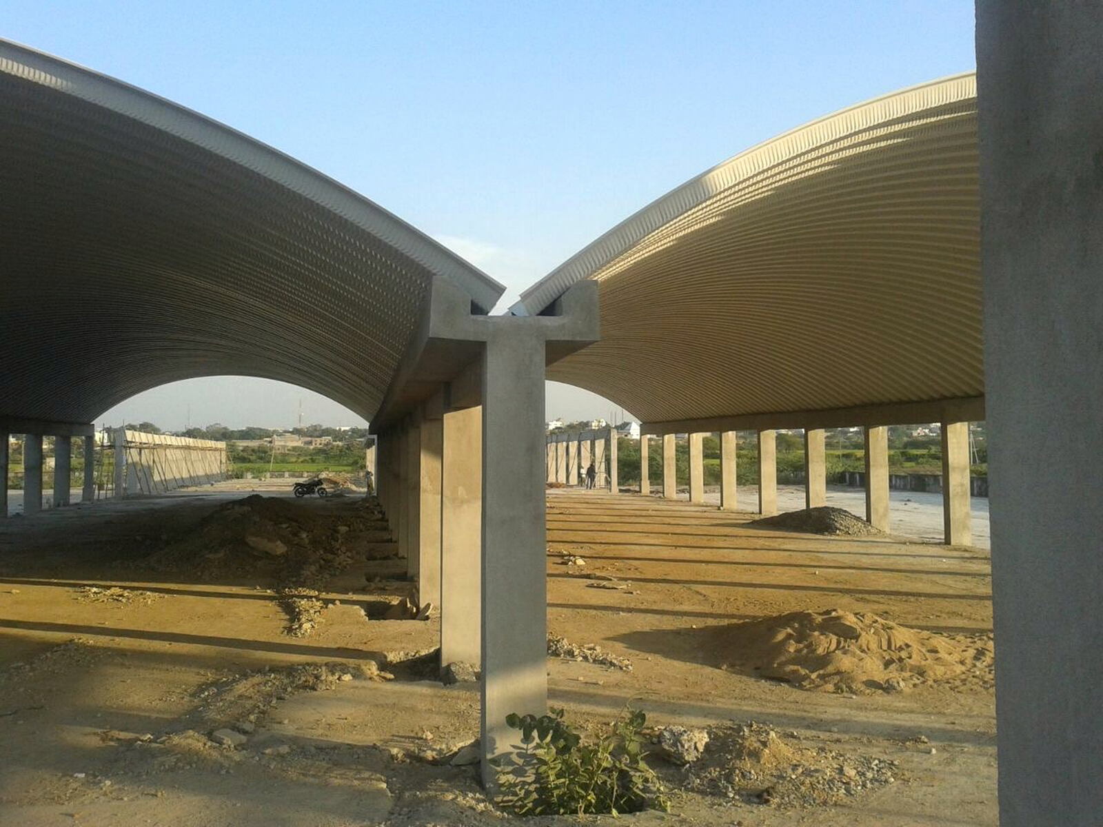 Conventional hall project showing two adjacent long-span curved roof structures.